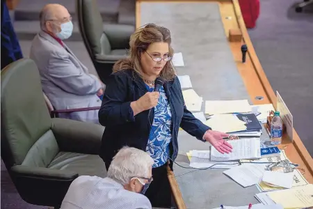  ?? EDDIE MOORE/JOURNAL ?? Rep. Patricia Lundstrom and David Abbey, director of the LFC, lower left, answer questions during the June 2020 special session, which pared back the state’s budget. New projection­s are more optimistic about the state’s financial outlook.