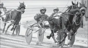  ?? TED PRITCHARD/TRURO DAILY NEWS ?? Darren Crowe guides Good Night Hanover to the win in the 2014 season opening race at the Truro Raceway. The provincial government has separated the Nova Scotia Provincial Exhibition from the Truro Raceway. The raceway will be managed by the Truro...