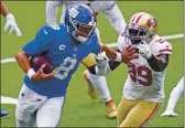  ?? COREY SIPKIN — THE ASSOCIATED PRESS FILE ?? The New York Giants’ Daniel Jones (8) tries to keep the San Francisco 49ers’ Jaquiski Tartt away during the second half Sunday, Sept. 27, in East Rutherford, N.J.