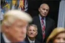  ?? EVAN VUCCI — THE ASSOCIATED PRESS ?? White House chief of staff John Kelly listens as President Donald Trump speaks during a meeting on tax policy with business leaders in the Roosevelt Room of the White House.