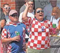  ?? MICHAEL SEARS / MILWAUKEE JOURNAL SENTINEL ?? Jeff Bohacek and his wife, Dajen Bohacek, celebrate Croatia's goal. Dajen's parents live in Croatia.