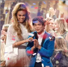  ?? TRAE PATTON/NBC VIA AP ?? This image released by NBC shows host Tyra Banks (left) with Shin Lim, winner of this season’s “America’s Got Talent.”