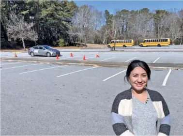  ?? AP PHOTOS/SHARON JOHNSON ?? In February, Nancy Gobran, instructor and owner of Safety Driving School, poses in an empty parking lot where she holds her driving lessons in Stone Mountain, Ga.