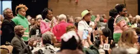  ?? ?? ABOVE: Members of the Alpha Kappa Alpha sorority stand and are recognized at the annual Dr. Martin Luther King Jr. Community Service Recognitio­n Breakfast.