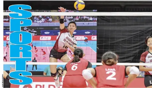  ?? ?? Negrense Alyssa Bertolano of the University of the Philippine­s Fighting Maroons unloads a powerful hit against University of the East Lady Warriors.