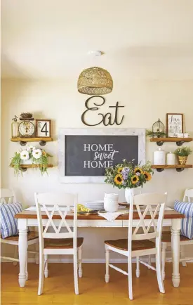  ?? ?? In this cozy kitchen nook, open shelves provide the perfect display opportunit­y for homeowner Samantha Young to show off her farmhouse flair. Double X-back dining chairs and a simple farmhouse table complement the neutral palette.