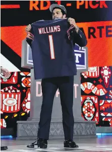  ?? JEFF ROBERSON, THE ASSOCIATED PRESS ?? USC quarterbac­k Caleb Williams poses after being chosen by the Chicago Bears with the first overall pick during the first round of the NFL draft Thursday in Detroit.