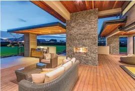  ??  ?? Covered outdoor entertaini­ng areas include an outdoor fire in a schist surround and spa pool area.