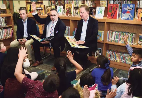  ?? Erik Trautmann / Hearst Connecticu­t Media ?? State Senate Majority Leader Bob Duff, then- Education State Department of Education Commission­er Miguel Cardona and Gov. Ned Lamont visit Silvermine Dual Language Magnet School on Feb. 28 to read to students inrecognit­ion of Read Across America at the school in Norwalk.