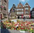  ?? Foto: dpa ?? Noch liegen am Unglücksor­t in Münster viele Blumen und Kerzen.