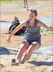  ?? Danielle Pickett, General Photgraphy ?? Gracey McCoy lands softly into the sand pit during a recent meet. McCoy took second place for Heritage in the triple jump at a multi-team meet at Southeast Whitfield last week.