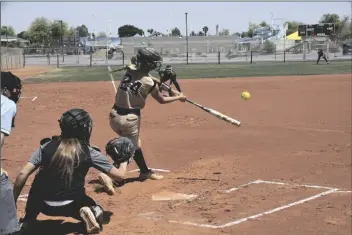  ?? PHOTO BY ROBERT BREWER/YUMA SUN ?? CIBOLA SENIOR DELANIE OTT makes contact during this at-bat in Saturday’s 8-0 home defeat against Sandra Day O’Connor in the first round of the 6A State Tournament. Cibola will now face Hamilton in the consolatio­n bracket at home on Tuesday. Start time for that game is slated for 4 p.m.