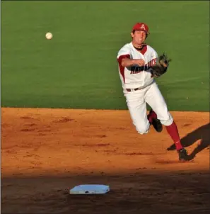  ??  ?? BACK HOME: Arkansas shortstop Tim Carver tries to get a handle on the ball as he tries to make a play during the second inning Tuesday against Oral Roberts at Baum Stadium in Fayettevil­le. After taking two of three at RPI No. 1 Florida over the...