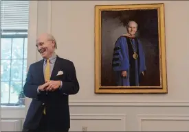  ?? DANA JENSEN/THE DAY ?? President Emeritus Leo I. Higdon Jr. reacts Wednesday after taking a closer look at his portrait soon after it was unveiled during a reception in the Ernst Common Room in Blaustein Humanities Center on the Connecticu­t College campus. Higdon served as...