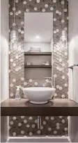  ??  ?? One powder room that had fun with a small space was this project by Tego Design &amp; Renovation Centre, which used geometric tiles.