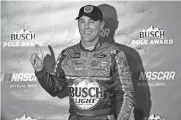  ??  ?? NASCAR Monster Energy Cup Series driver Kevin Harvick poses for a photo after winning the pole position during Friday’s qualifying for the Can-Am 500 at ISM Raceway.