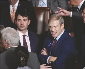  ?? AP PHOTO/J. SCOTT APPLEWHITE ?? Rep. Jim Jordan, R-Ohio, chairman of the House Judiciary Committee, talks with members as the House convenes for a second day of balloting to elect a speaker, at the Capitol in Washington, on Wednesday.