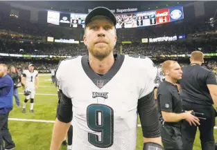  ?? JONATHAN BACHMAN/GETTY IMAGES ?? Nick Foles sounded as if he has played his final game in an Eagles uniform after Philadelph­ia lost 20-14 to New Orleans on Sunday. The Eagles would have to pay him around $20 million next season to stay.