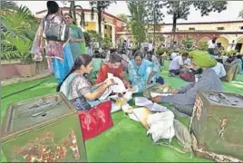  ?? GURPREET SINGH/HT ?? Staff carrying election material on the eve of the zila parishad and panchayat samiti elections at Khalsa College for Women in Ludhiana on Tuesday.