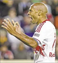  ?? Getty ?? Thierry Henry and Red Bulls turn in spirited effort against East’s top club, Sporting Kansas City, and earn at least wild-card playoff berth.