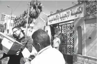  ?? Associated Press ?? A truck loaded with goods arrives Sunday for Christian families who fled el-Arish at the Evangelica­l Church in Ismailia, Egypt. Egyptian Christians fearing attacks by Islamic State militants are fleeing the volatile northern part of the Sinai Peninsula...