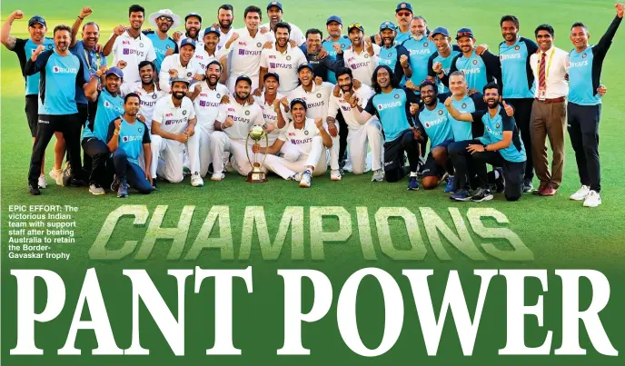  ??  ?? EPIC EFFORT: The victorious Indian team with support staff after beating Australia to retain the BorderGava­skar trophy