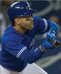  ?? RICK MADONICK, TORONTO STAR ?? Devon Travis misses a bunt, but got his second double of the game in the sixth, giving him the most two-base hits in a month by a Blue Jays second baseman. He surpassed Aaron Hill’s mark of 11 set in 2009. DHIREN MAHIBAN