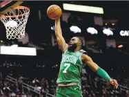  ?? David J. Phillip / Associated Press ?? The Boston Celtics’ Jaylen Brown goes up to dunk against the Houston Rockets on Feb. 11 in Houston.