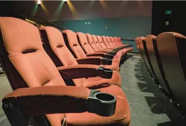  ?? DREAMSTIME ?? Giving theaters more material to play, such as TV shows, could help bring back patrons who’ve been staying home.