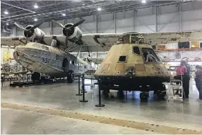  ?? JESSICA GRESKO/THE ASSOCIATED PRESS ?? The Apollo 11 capsule, right, sits in the restoratio­n hanger at the National Air and Space Museum in Chantilly, Va., ahead of a planned four-city U.S. tour.