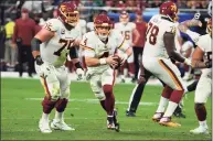  ?? Rick Scuteri / Associated Press ?? Washington Football Team quarterbac­k Taylor Heinicke (4) during the second half of against the Las Vegas Raiders on Sunday.