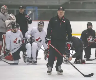  ?? RYAN REMIORZ/THE CANADIAN PRESS ?? Canada’s head coach Dale Hunter runs practice at the world junior hockey championsh­ip on Sunday in Ostrava, Czech Republic. The session was long on defensive drills.