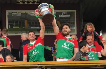  ??  ?? James Sheerin (right) lifts the championsh­ip trophy with Mattie Guiheen after helping Garrycastl­e to victory over St. Loman’s in the Westmeath county final last October.