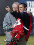  ?? Brian Spurlock ?? Arnold Palmer and his caddie take a selfie on the Swilcan Bridge Wednesday during the Champion Golfers Challenge at St. Andrews.