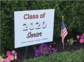  ?? BILL DEBUS — THE NEWS-HERALD ?? A yard sign on Second Street in Fairport Harbor salutes a senior who is graduating as part of the Harding High School Class of 2020.