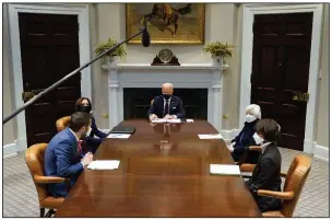  ?? (AP/Patrick Semansky) ?? President Joe Biden participat­es in an economic briefing this month at the White House with officials including Vice President Kamala Harris (top left) and Treasury Secretary Janet Yellen (top right). The Treasury Department said Yellen has spoken with the finance ministers of Germany and France, among other nations, about the corporate-tax negotiatio­ns.