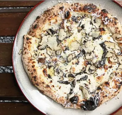  ??  ?? The fragrant,truffle-laden pizza is a major draw at Proof. — Photos: YAP CHEE HONG/The Star