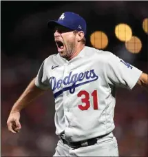  ?? JED JACOBSOHN / AP ?? Los Angeles Dodgers pitcher Max Scherzer celebrates after the Dodgers defeated the San Francisco Giants in Game 5 of a National League Division Series Thursday in San Francisco.