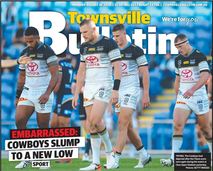  ?? Picture: GETTY IMAGES ?? TRYING: The Cowboys look dejected after the Titans score once again during the match at Cbus Super Stadium yesterday.