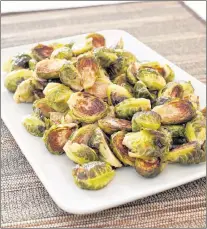  ?? CARL TREMBLAY/AMERICA’S TEST KITCHEN VIA AP ?? Roasted Brussels sprouts from a recipe in the cookbook “Complete Makeahead.”