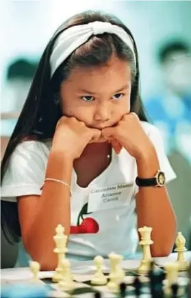  ?? (Supplied Photo) ?? GM Joey Antonio’s wellkept photo of Arianne Caoili, playing chess, in her teen.