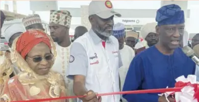  ?? ?? L-R: Ramota Gbemisola, mother of the managing director, Fatgbems Group; Kabir Gbemisola, managing director, Fatgbems Group; and Damola Oke, chairman, at the commission­ing of Fatgbems Petroleum Solar Powered Retail Station in Abeokuta, Ogun, recently
