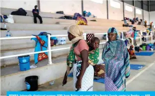  ?? — AFP ?? PEMBA: Internally displaced women (IDP) from Palma are seen at the Pemba Sports center in Pemba.