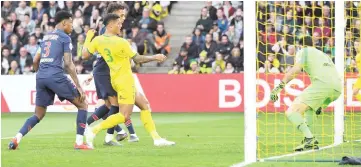  ??  ?? Nantes’ Brazilian defender Diego Carlos (C) scores during the French L1 football match between Nantes (FC Nantes) and Paris SaintGerma­in (PSG) at the La Beaujoire stadium in Nantes, western France. — AFP photo