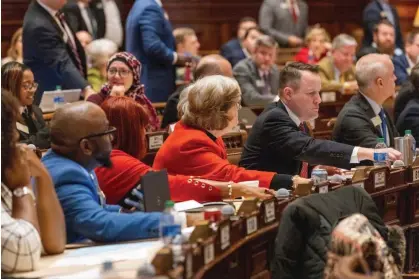  ?? ?? Georgia lawmakers vote on new congressio­nal maps at the state capitol in Atlanta on 7 December 2023. Photograph: Arvin Temkar/AP
