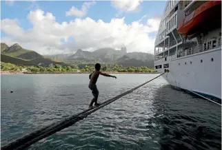  ??  ?? At Ua Pou, Aranui 5 doubles as a playground, as local kids walk the lines between ship and pier.