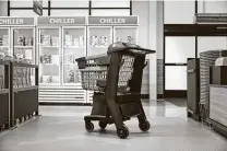  ?? Courtesy photo / Amazon ?? Amazon’s shopping cart uses sensors to detect what shoppers drop in. It keeps a tally and then charges their Amazon account.