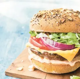  ?? GREG DUPREE/EATINGWELL ?? Portobello mushrooms stand in for meat patties in this recipe for veggie burgers with all the fixings.