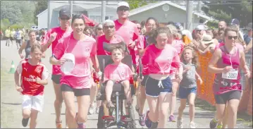  ?? ANN DAVIDSON ?? They came as a team and finished as a team with younger members of the family joining them at the end of the 20-kilometre run this past Sunday at TBL.