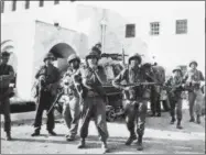  ??  ?? Left: In this June 6, 1967file photo, Israeli troops are seen at Government House in the old city of Jerusalem after they had taken over the Jordan held part of the city following heavy fighting. A half century after the watershed 1967 Mideast war,...